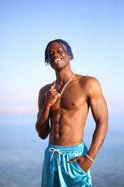 designer swimwear Switzerland skyline by baumann satin teal shorts